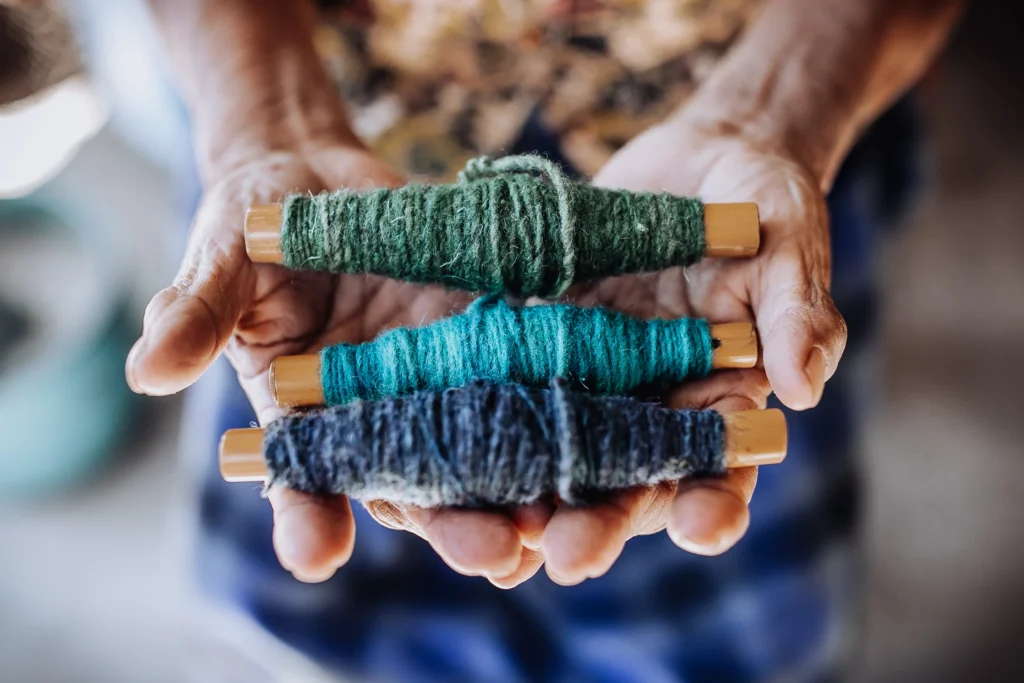 Dyed yarn in artisan's hands