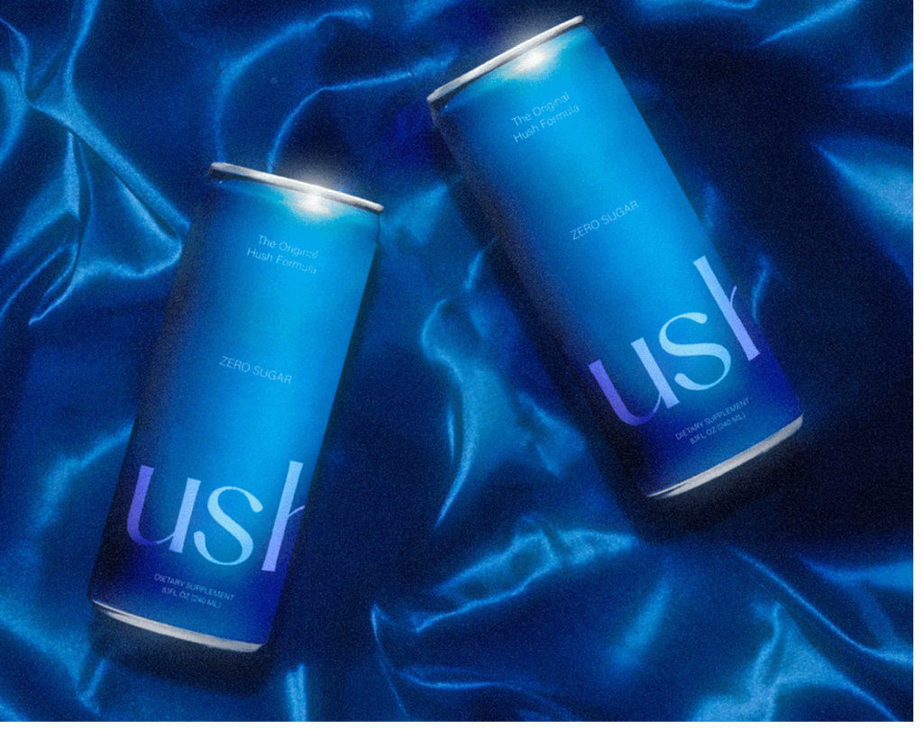 Hush two cans on blue silk background