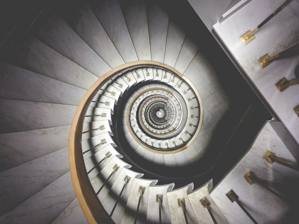 spiral staircase-unsplash image by Ludde Lorentz