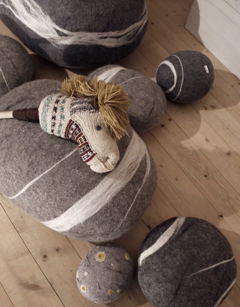 Group of wool poufs with hobbyhorse