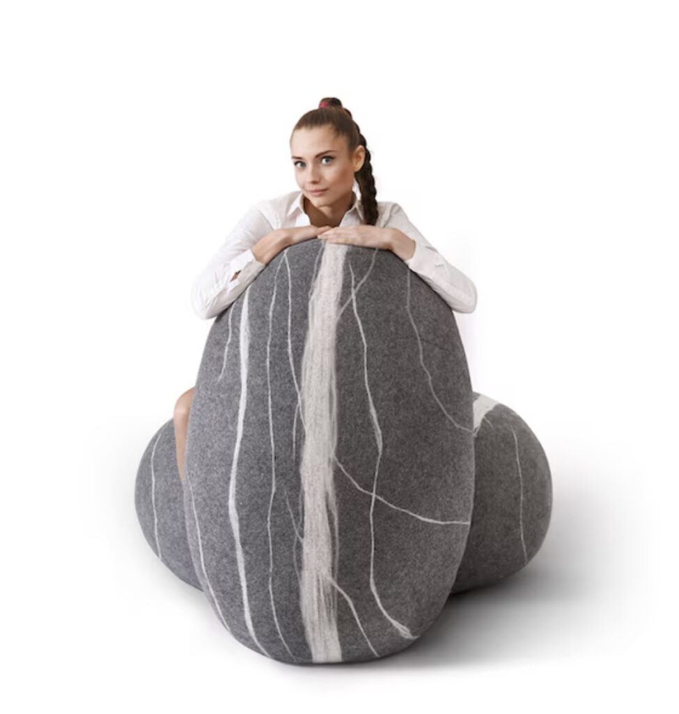 Woman hugging large Katsu wool poufs