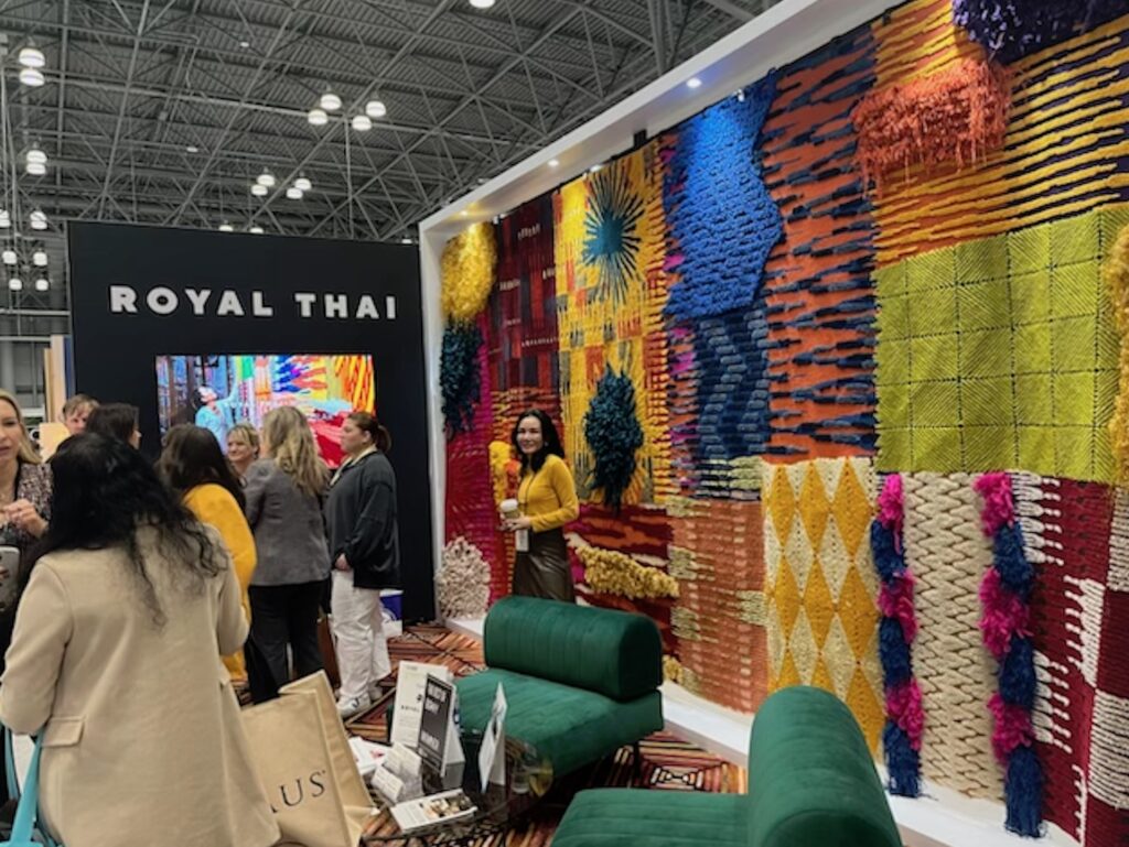 Royal Thai booth at BDNY showing wall of handmade textiles