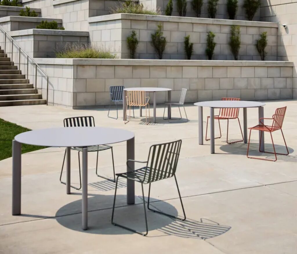 Three circular tables in courtyard