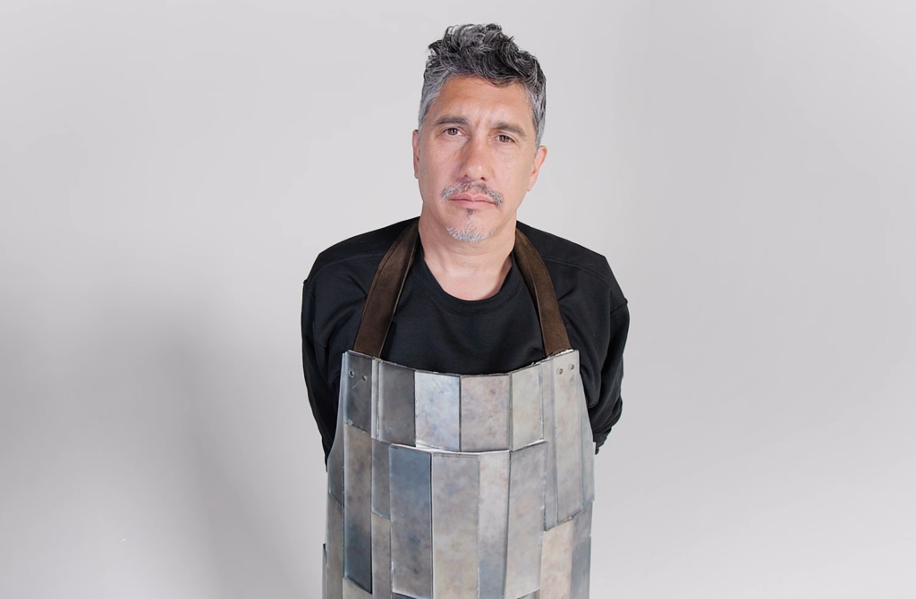 Mark De La Vega in tile apron