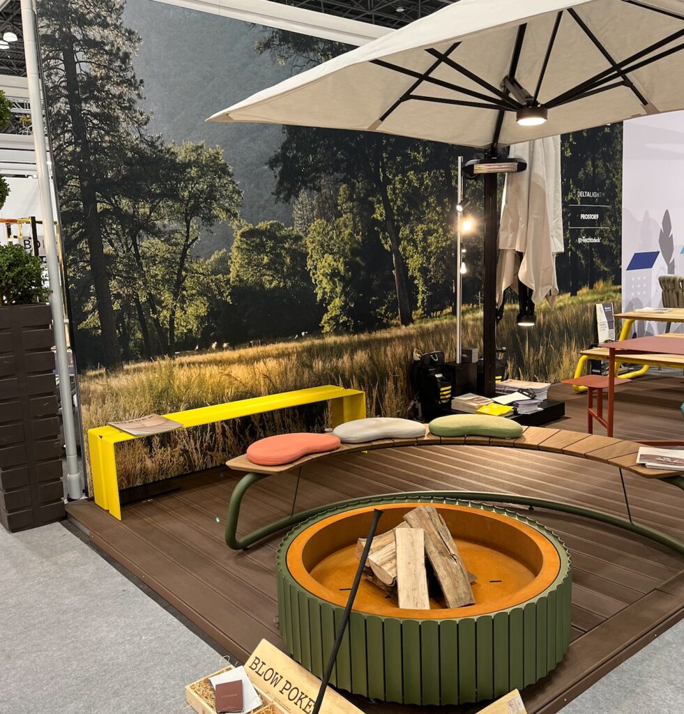 Wünder assortment at BDNY of fire pit, curved bench, and umbrella