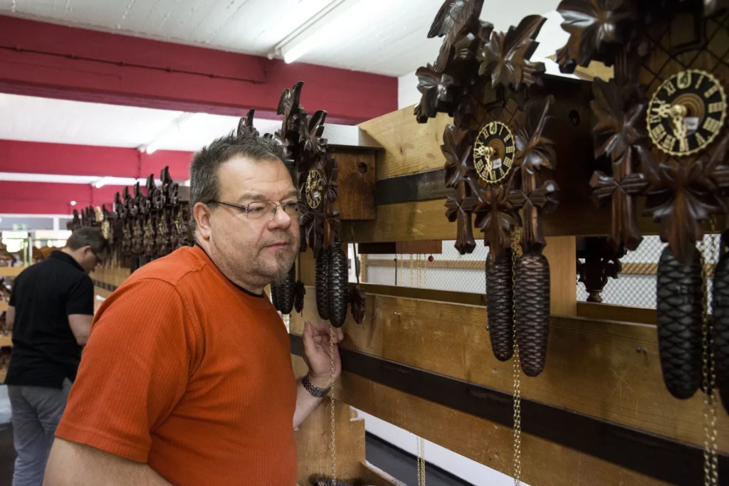 man with cuckoo clocks